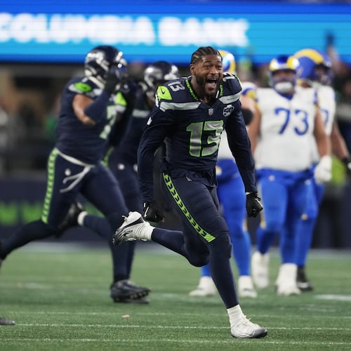 Seahawks linebacker Ernest Jones (right) celebrates after the NFC championship game victory over the Rams on Sunday, Jan. 25, 2026, in Seattle. Jones starred in high school at Ware County. (Lindsey Wasson/AP)