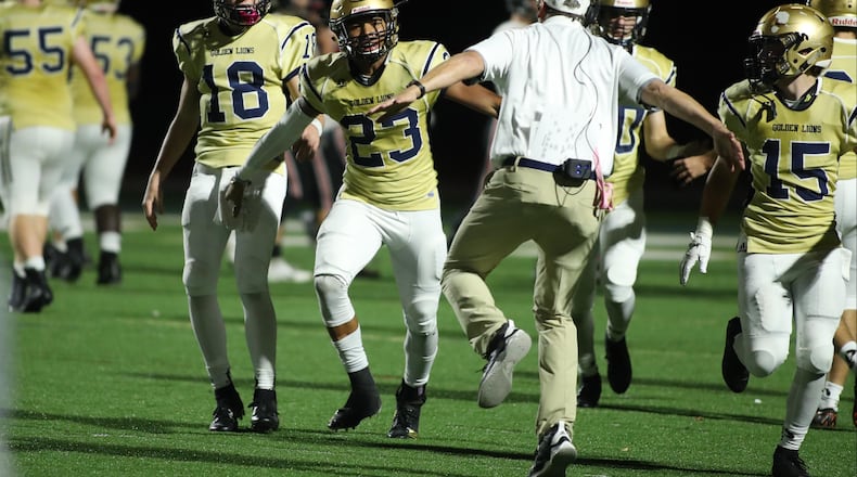 October 12, 2018 - Atlanta: St. Pius defensive back Zachary Ranson (23) celebrates his interception returned for a touchdown in the fourth quarter against North Oconee Friday, October 12, 2018, in Atlanta. The defensive score secured St. Pius' 31-21 win over North Oconee. (JASON GETZ/SPECIAL TO THE AJC)