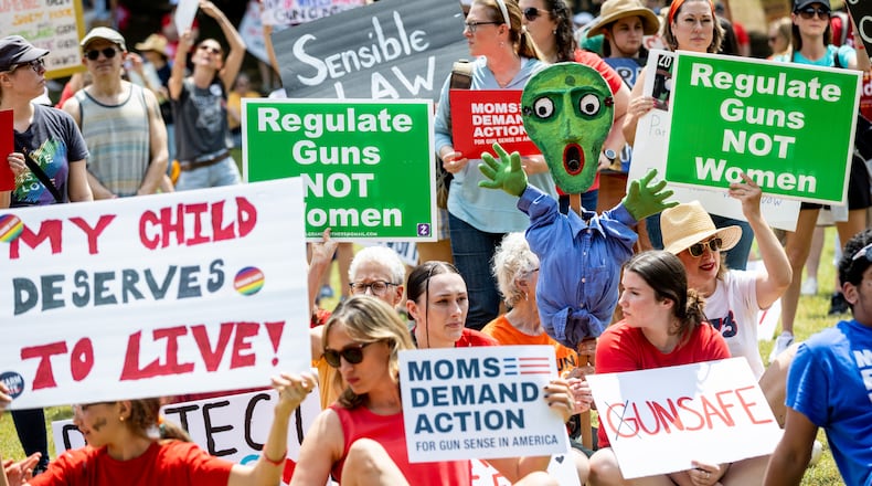 Gun safety measures are expected to be a hot topic in the next legislative session in Georgia. The photo was taken at a rally in Piedmont Park in May.