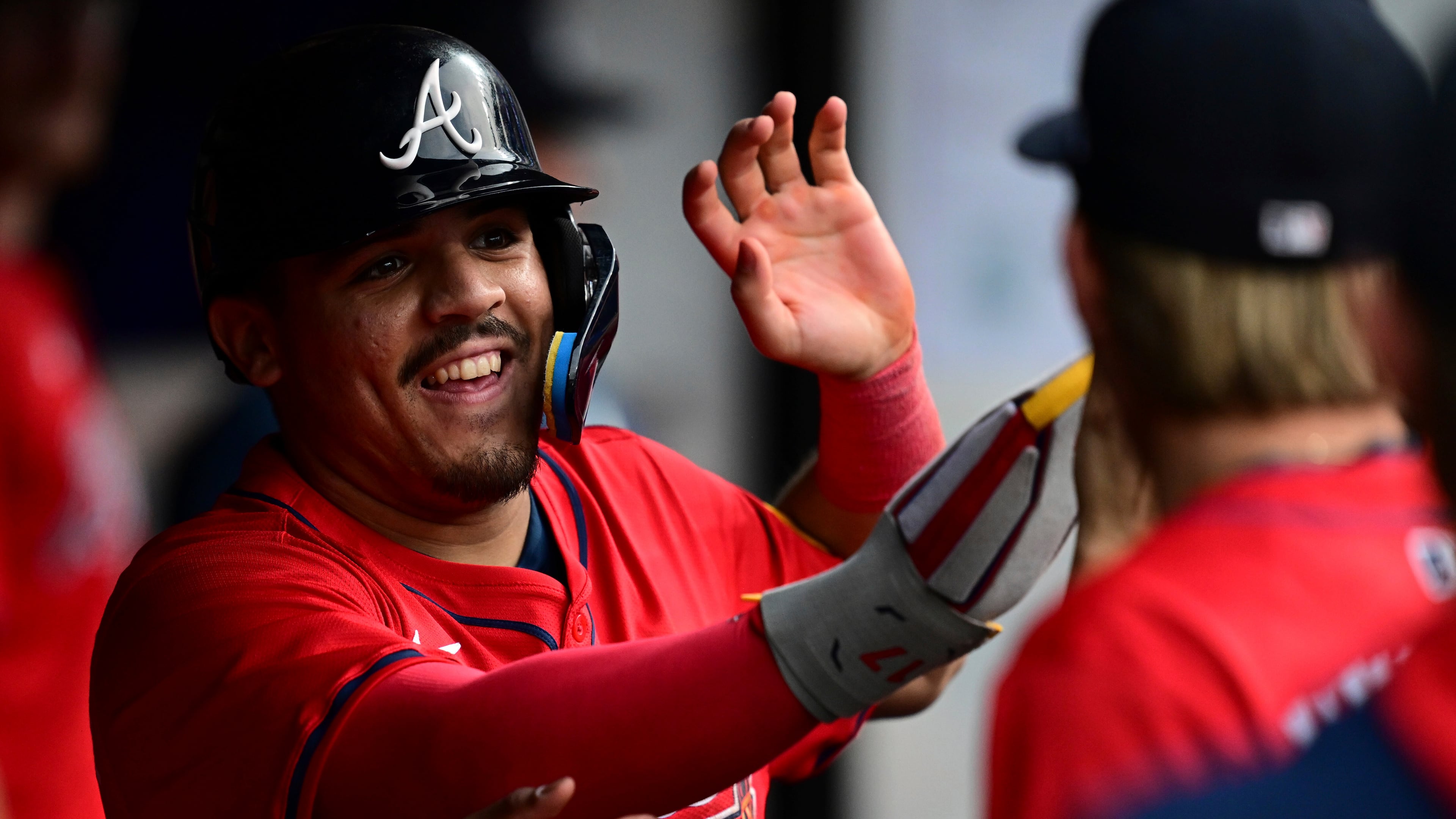 Atlanta Braves' Nacho Alvarez Jr. is congratulated in the dugout after scoring on a two-RBI double by Nick Allen during the second inning of a baseball game against the Cleveland Guardians, Saturday, Aug. 16, 2025, in Cleveland. (David Dermer/AP)