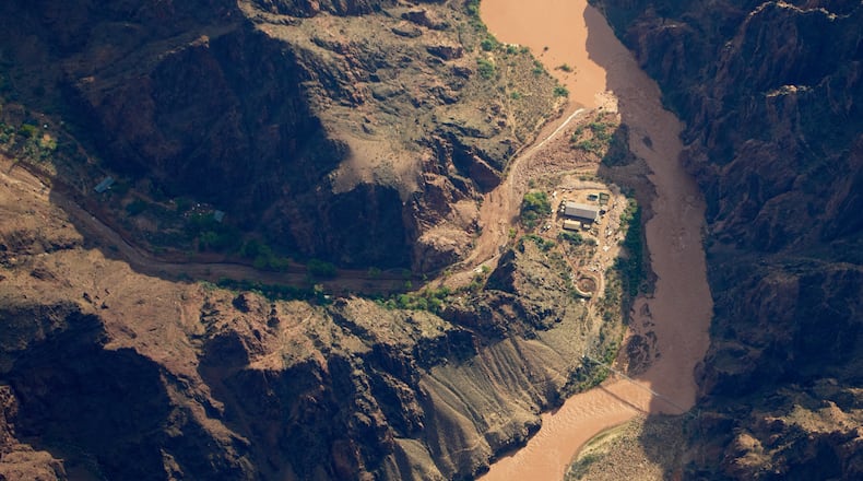 Bright Angel Canyon, damaged by flash floods, runs into the Colorado River in the Grand Canyon, Monday, Aug. 31, 2026, at Grand Canyon National Park, Ariz. (AP Photo/John Locher)