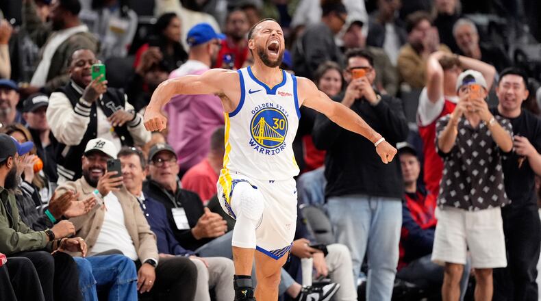 Golden State Warriors guard Stephen Curry celebrates after scoring during the second half of an NBA play-in tournament basketball game against the LA Clippers, Wednesday, April 15, 2026, in Inglewood, Calif. (AP Photo/Mark J. Terrill)