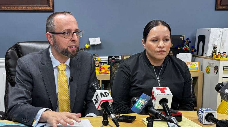 Patrick Kolasinski, attorney for Carlos Ivan Mendoza Hernandez, speaks at a news conference accompanied by his client's girlfriend, Cindy, in Modesto, Calif., Wednesday, April 8, 2026. (AP Photo/Terry Chea)