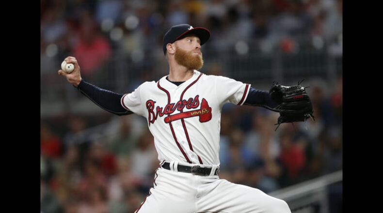 <p> Atlanta Braves center fielder Ender Inciarte (11) rounds second base as he scores from first on an Ozzie Albies' double in the first inning of a baseball game against the Cincinnati Reds Monday, June 25, 2018, in Atlanta.(AP photo/John Bazemore) </p> <p> Atlanta Braves starting pitcher Mike Foltynewicz (26) works in the first inning of a baseball game against the Cincinnati Reds Monday, June 25, 2018, in Atlanta. (AP photo/John Bazemore) </p> <p> Cincinnati Reds right fielder Scott Schebler (43) connects on a solo-home run in the fifth Inning of a baseball game against the Atlanta Braves Monday, June 25, 2018, in Atlanta.(AP photo/John Bazemore) </p> <p> Cincinnati Reds starting pitcher Tyler Mahle (30) works in the first inning of a baseball game against the Atlanta Braves Monday, June 25, 2018, in Atlanta. (AP photo/John Bazemore) </p> <p> Atlanta Braves' Danny Santana (23) is tagged out by Cincinnati Reds catcher Tucker Barnhart (16) after being caught in a rundown between third base and home on an Ender Inciarte ground ball in the sixth inning of a baseball game Monday, June 25, 2018, in Atlanta. (AP photo/John Bazemore) </p> <p> Fans take cover from the rain as they wait for the start of a baseball game between Cincinnati Reds and Atlanta Braves Monday, June 25, 2018, in Atlanta. (AP photo/John Bazemore) </p>