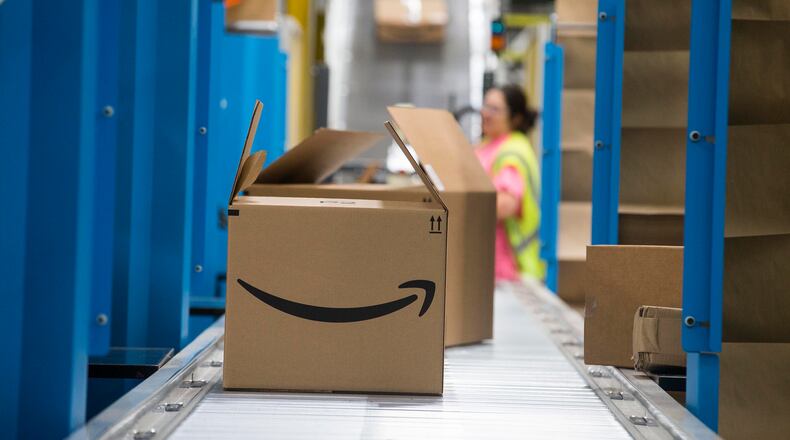 An Amazon package is prepared for distribution at the Fulfillment Center in Jefferson.
