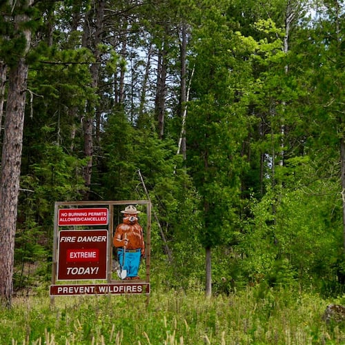 Signage near the Minnesota Department of Natural Resources' office in Tower, Minn., notes extreme fire danger ,Tuesday, July 14, 2026. (Anthony Soufflé/Minnesota Star Tribune via AP)