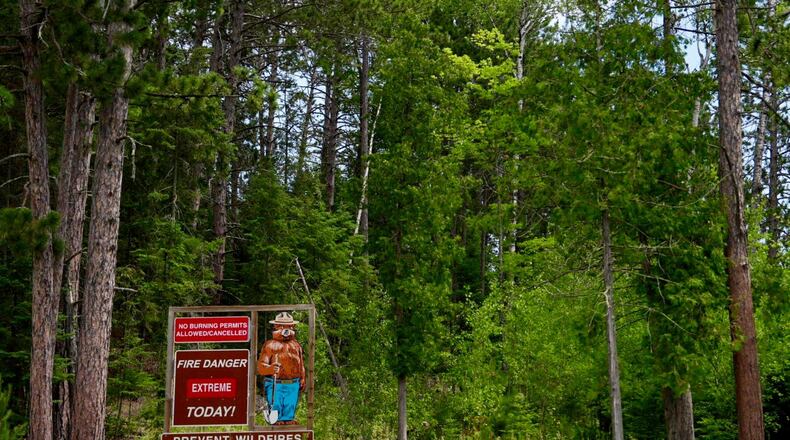 Signage near the Minnesota Department of Natural Resources' office in Tower, Minn., notes extreme fire danger ,Tuesday, July 14, 2026. (Anthony Soufflé/Minnesota Star Tribune via AP)