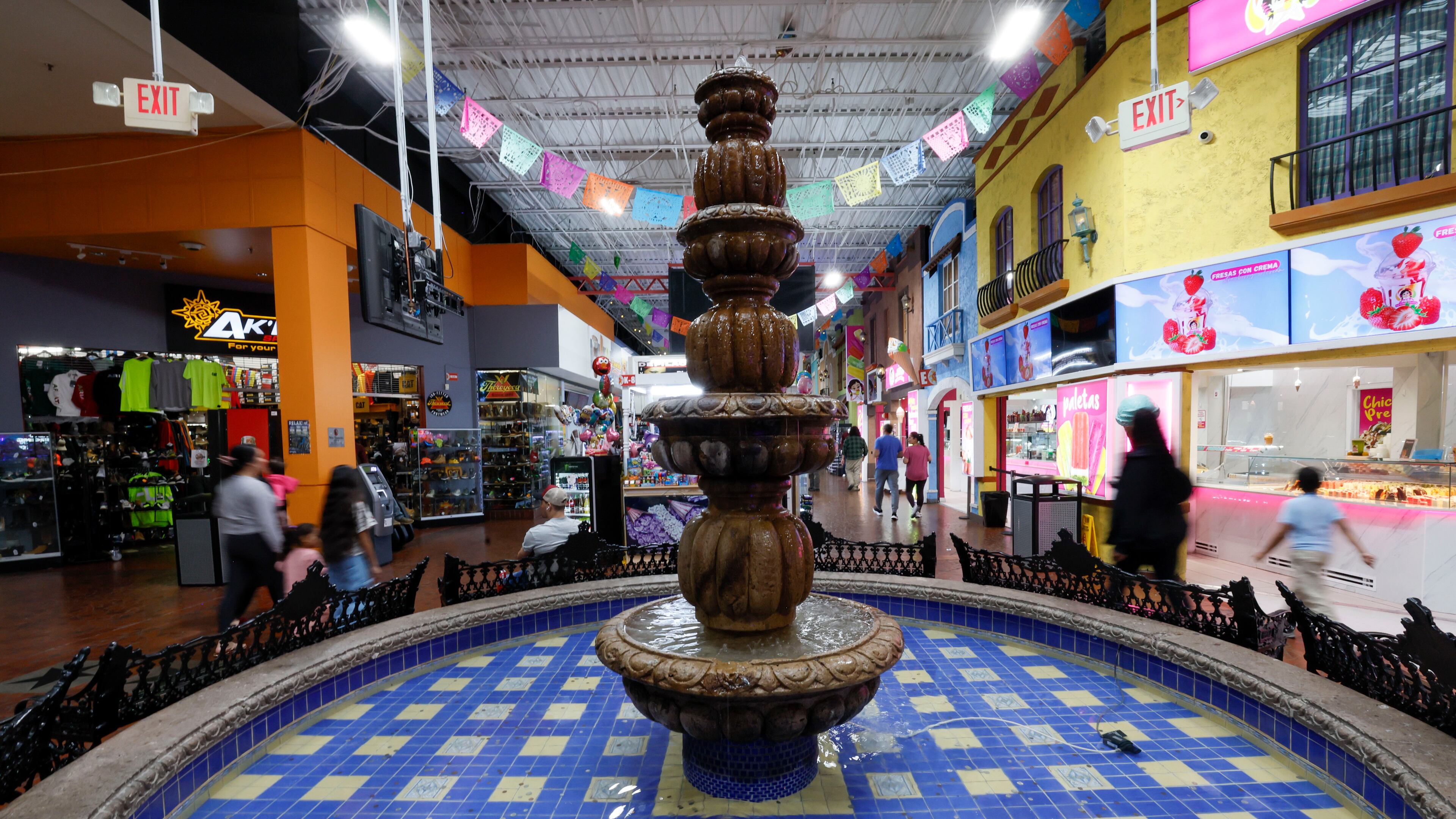 People walk up and down the main aisle at Plaza Fiesta on Wednesday, May 7, 2025. Some shop owners have observed a decline in their sales. The Trump administration has caused immigrant communities to feel worried and uncertain. (Miguel Martinez/AJC)