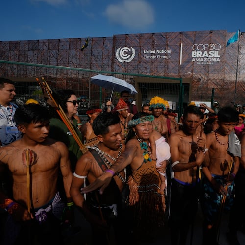 An Indigenous group blocks an entrance to the COP30 U.N. Climate Summit, Friday, Nov. 14, 2025, in Belem, Brazil. (AP Photo/Fernando Llano)