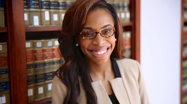 Marriah N. Paige, 27, shown in the law library at the University of Tennessee, had to recalculate her route after the results of her first bar exam left her heartbroken. CONTRIBUTED BY PATRICK MORRISON