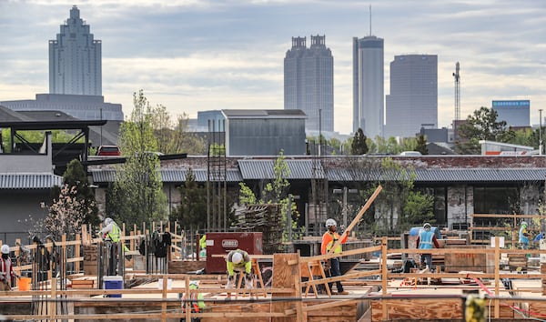 Workers construct 1050 Brickworks in West Midtown on Tuesday, March 28, 2023. (John Spink/AJC 2023)