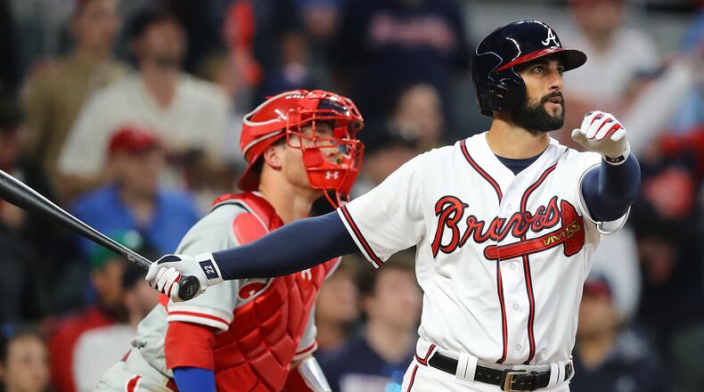 Braves outfielder Nick Markakis hits a walk off 3-RBI home run to beat the Phillies 8 to 5 in a MLB baseball home opening game on Thursday, March 29, 2018, in Atlanta.  Curtis Compton/ccompton@ajc.com