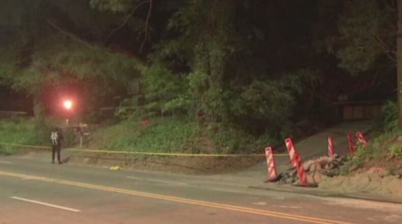 Investigators looked for evidence at the Martin Luther King Jr. Drive home in southwest Atlanta early Thursday morning.