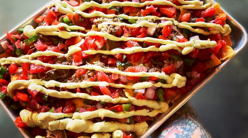 Chef Kevin Gillespie serves sheet-tray nachos at Slabtown Public House. Courtesy of Slabtown Public House