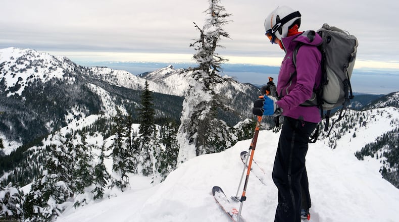 Telemark skier Meghan Ahearn prepares to drop in off of Sunrise Ridge in Olympic National Park. (Caitlin Moran/The Seattle Times/TNS)