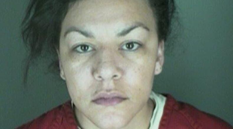 This undated booking photo provided by the Longmont Police Department shows Dynel Lyne, 34, who is accused of stabbing a pregnant woman in the stomach and removing her baby, while the expectant mother visited her home to buy baby clothes advertised on Craigslist authorities said. The 26-year-old expectant mother was found beaten and stabbed at the suspect's home, has undergone surgery, and on Thursday was alert, police said. The baby did not survive. (AP Photo/ Longmont Police Department)