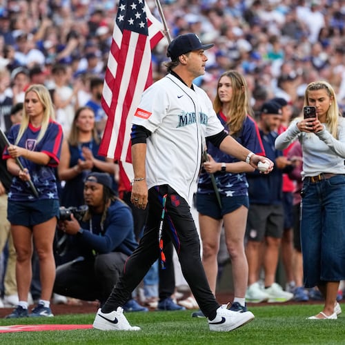 FILE - United States men's national soccer team head coach Mauricio Pochettino walks out to throw out the ceremonial first pitch before a baseball game between the Seattle Mariners and the Toronto Blue Jays, July 3, 2026, in Seattle. (AP Photo/Lindsey Wasson, File)