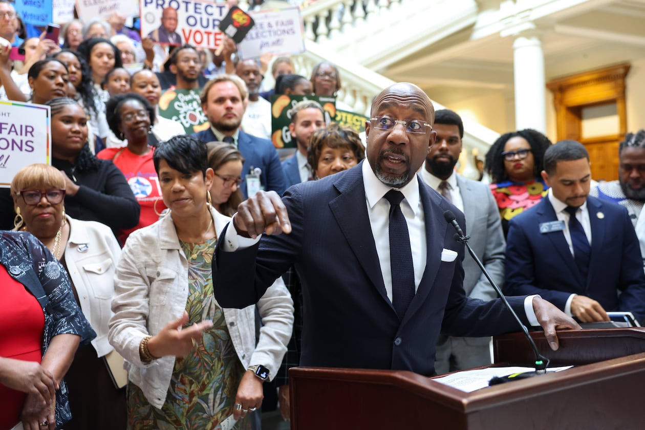 Democratic U.S. Sen. Raphael Warnock speaks at a news conference before the state Legislature convenes for a special session in Atlanta last month. (Arvin Temkar/AJC)