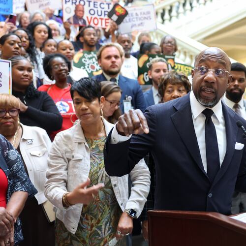 Democratic U.S. Sen. Raphael Warnock speaks at a news conference before the state Legislature convenes for a special session in Atlanta last month. (Arvin Temkar/AJC)