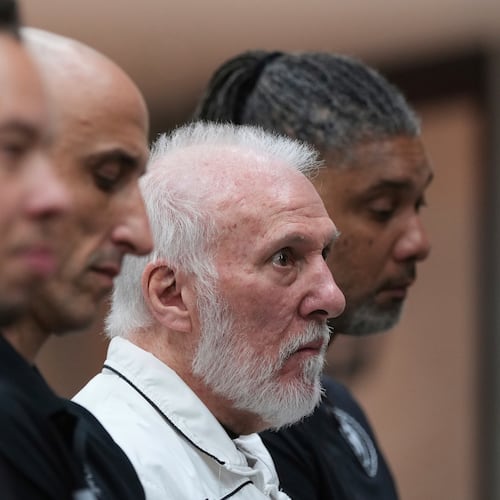 FILE - Former San Antonio Spurs head coach Gregg Popovich, second from right, sits between former players Manu Ginobili and Tim Duncan, right, as he waits to introduce Mitch Johnson, left, as the new head coach of the San Antonio Spurs NBA basketball team, in San Antonio, Monday, May 5, 2025. (AP Photo/Eric Gay, File)