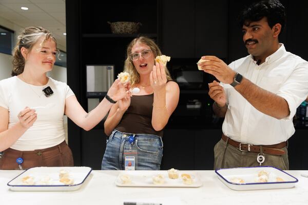 From left, AJC analyst engineer Keely Culbertson, lifestyle and food reporter Olivia Wakim and data journalist Rahul Deshpande participate in the “Best Banana Pudding” video shoot for the AJC in Atlanta on Wednesday, Aug. 5, 2026. (Estela Muñoz/AJC)