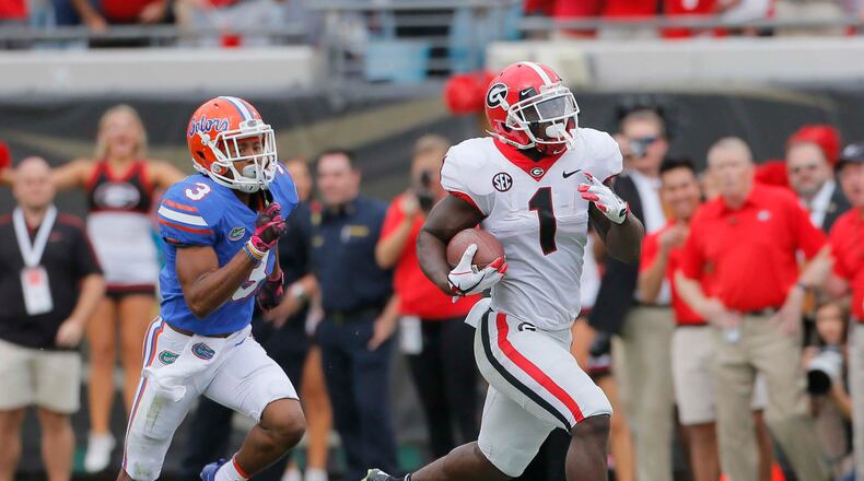 10/28/17 - Jacksonville, FL - Georgia Bulldogs running back Sony Michel (1) breaks free to score Georgia's third TD in the first quarter. NCAA football game between Georgia and Florida at EverBank Field in Jacksonville. BOB ANDRES /BANDRES@AJC.COM