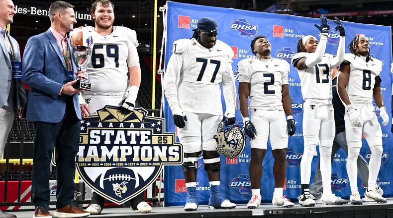 Deontavis Cooper (77), center, is shown with his teammates after the Thomas County Central Yellow Jackets beat the Gainesville Red Elephants 62-21 to win their Class 5A championship game Wednesday, Dec. 17, 2025, at Mercedes-Benz Stadium. (Daniel Varnado for the AJC)