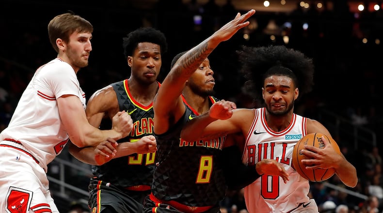 Coby White of the Chicago Bulls drives against Tyrone Wallace (8) of the Atlanta Hawks in the second half at State Farm Arena on November 06, 2019 in Atlanta, Georgia.