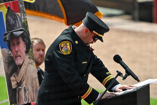 DeKalb County fire Capt. Jake Sosebee gets emotional as he speaks about firefighter Preston Fant during a memorial service Thursday. (Hyosub Shin/AJC)