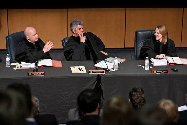 Presiding Justice Nels Peterson speaks to attorney Gilbert Dickey (not pictured) as Chef Justice Michael Boggs (center) and Justice Sarah Warren (right) listen during oral arguments in an appeal of State Election Board rules at the Georgia Supreme Court off-site special session at Booth Western Art Museum on Wednesday, March 19, 2025, in Cartersville. (Hyosub Shin/AJC)