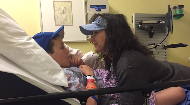 Jack Burke and his mother Beth O'Brien are pictured before brain surgery. Jack describes himself as an average teenager but his fight against a rare genetic disorder that causes multiple tumors on the body has inspired people to help find a cure for his condition.