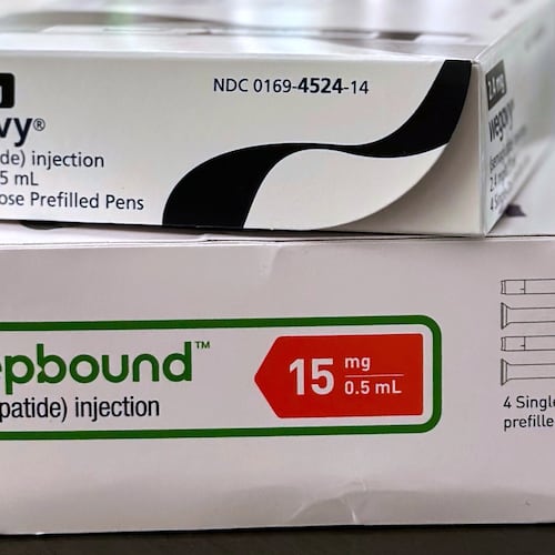 FILE - Boxes for the medications Wegovy and Zepbound are arranged for a photograph in California, May 8, 2025. (AP Photo/JoNel Aleccia, File)