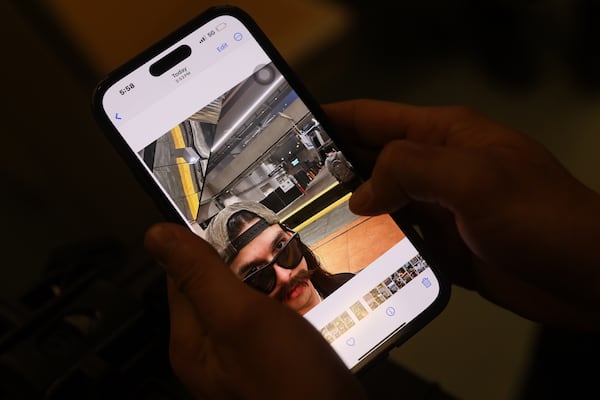 Jonathan Tennies shows his selfies on the train while attempting to set a Guinness World Record for the fastest time visiting every single MARTA station in Atlanta on Thursday, Jan. 8, 2026. (Abbey Cutrer/AJC)