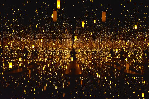 “Aftermath of Obliteration of Eternity” is one of the “Infinity Mirrors” rooms at the Yayoi Kusama exhibit at High Museum. Visitors may stay in each room for a very limited amount of time, but it can still make an impact. HYOSUB SHIN / HSHIN@AJC.COM