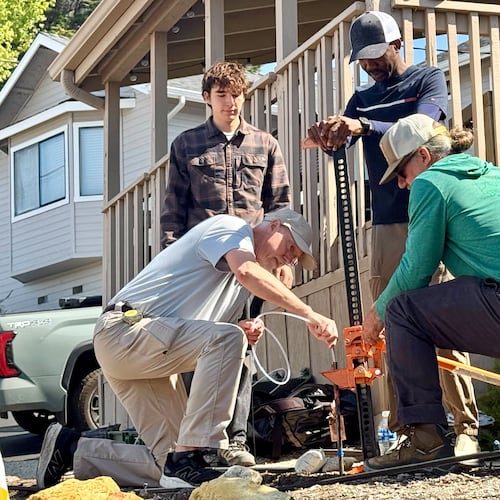 Authorities take samples from the soil Thursday, May 7, 2026, from the neighboring yard of a home in Arroyo Grande, Calif., connected to the man convicted of killing Kristin Smart. (AP Photo/Haven Daley)