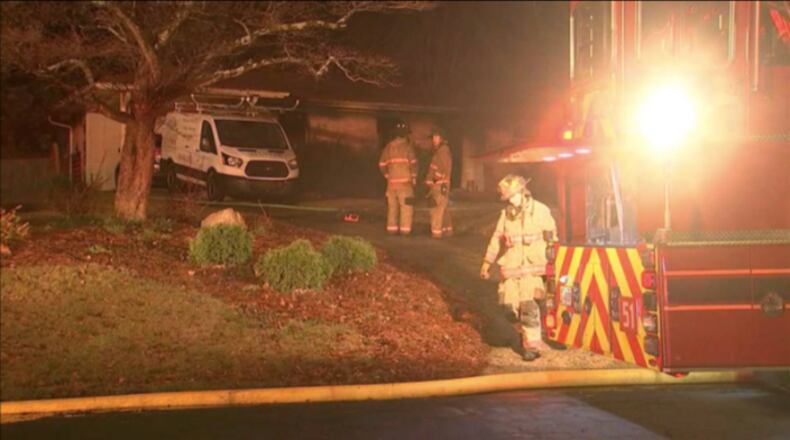 The fire swept through a home at the intersection of Polk and Hope streets in Marietta.