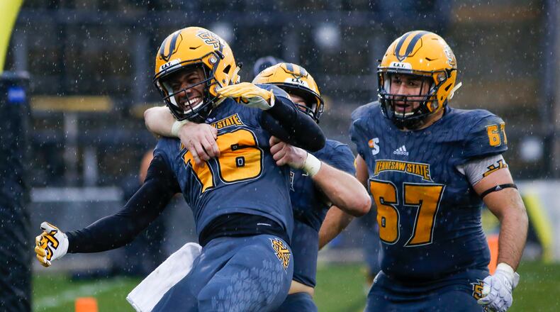 12-8-18 - Kennesaw, GA - Kennesaw State wide receiver Xavier Harper (16) celebrates teammate Jake McKenzie's (4) touchdown catch during the second half of an FCS quarterfinal college football game between Kennesaw State and South Dakota State at Fifth Third Bank Stadium in Kennesaw, Ga., on Saturday, Dec. 8, 2018. (Casey Sykes for The Atlanta Journal-Constitution)