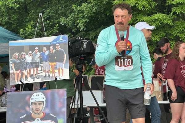 Guy Gaudreau, father of hockey players Johnny and Matthew Gaudreau who were fatally struck by a motorist while riding bicycles, addresses the crowd at the inaugural Gaudreau Family 5K Walk, Run and Family Day, Saturday, May 31, 2025, in Sewell, N.J. (AP Photo/Stephen Whyno)