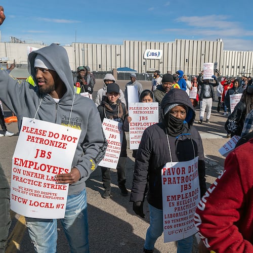 Workers from the JBS Beef Plant protest across the road from the plant on March 16, 2026 in Greeley, Colo. (Jerilee Bennett/The Gazette via AP)