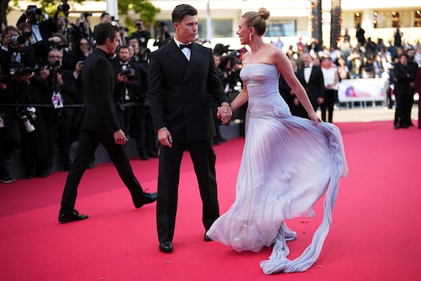 Colin Jost, left, and Scarlett Johansson pose for photographers upon arrival at the premiere of the film 'A Private Life' at the 78th international film festival, Cannes, southern France, Tuesday, May 20, 2025. (Photo by Scott A Garfitt/Invision/AP)
