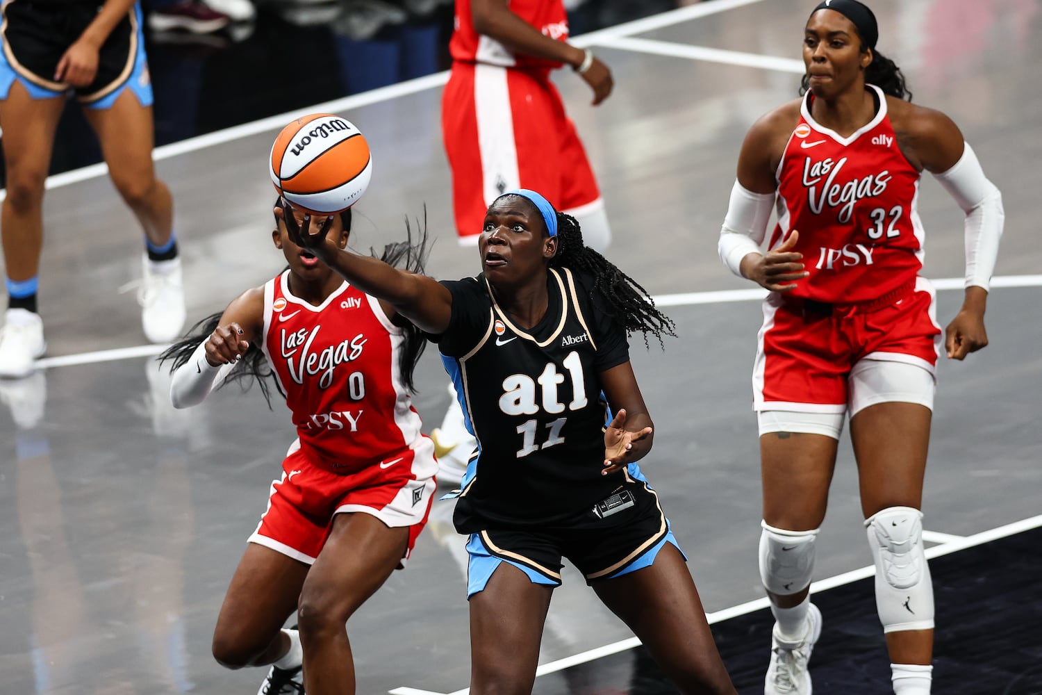 Atlanta Dream center Madina Okot (11) shoots against Las Vegas Aces guard Jackie Young (0) during the second half of a WNBA game at State Farm Arena on Sunday, May 17, 2026, in Atlanta. (Colin Hubbard for the AJC) 