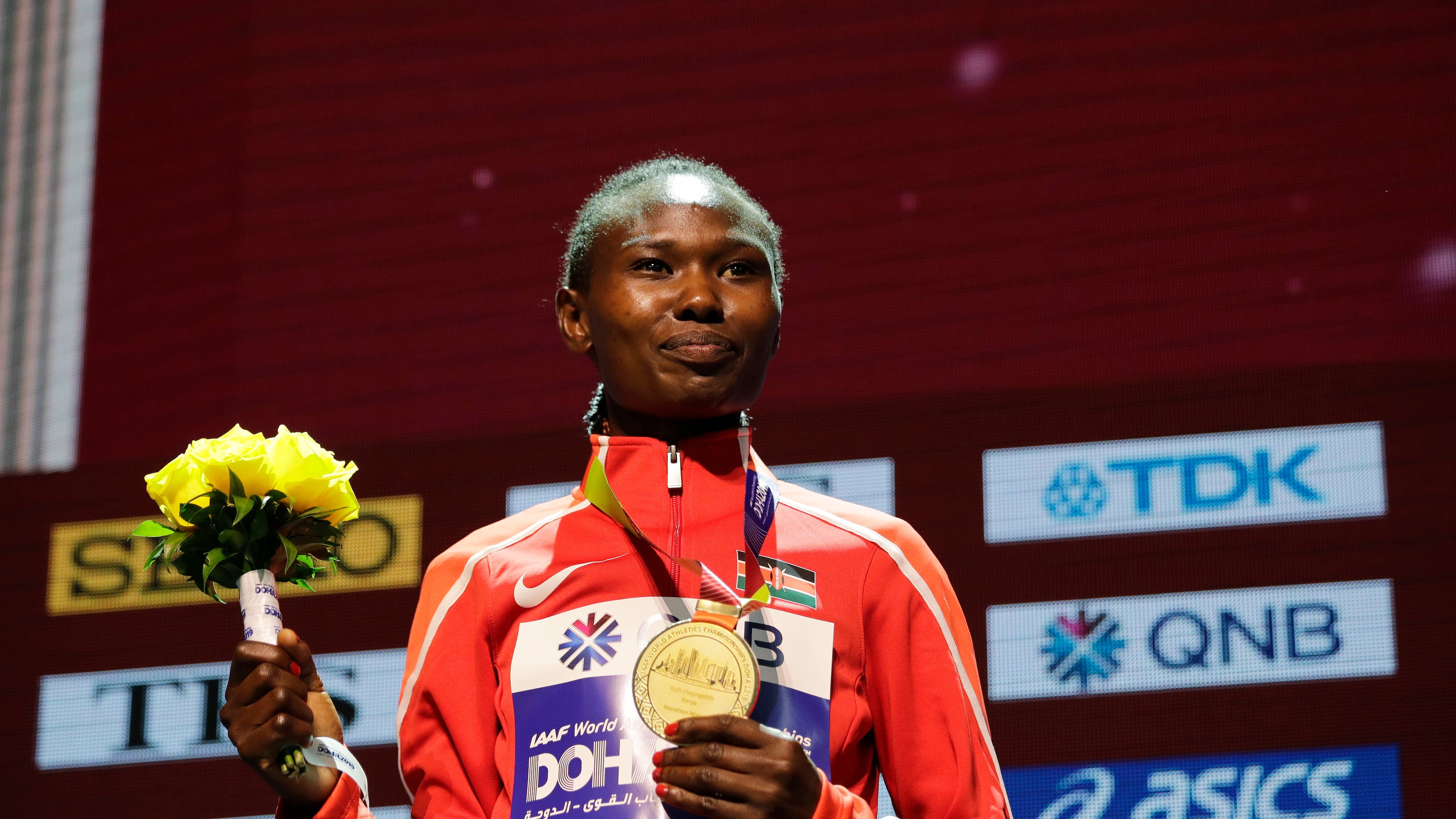 FILE - Kenya's Ruth Chepngetich poses with her gold medal during the medal ceremony for the women's marathon at the World Athletics Championships in Doha, Qatar, Sept. 28, 2019. (AP Photo/Nariman El-Mofty, file)