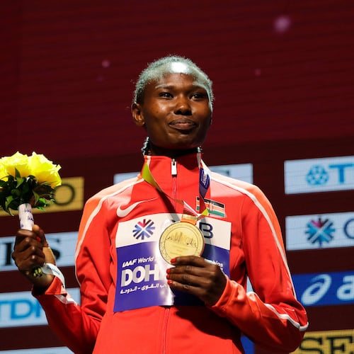 FILE - Kenya's Ruth Chepngetich poses with her gold medal during the medal ceremony for the women's marathon at the World Athletics Championships in Doha, Qatar, Sept. 28, 2019. (AP Photo/Nariman El-Mofty, file)
