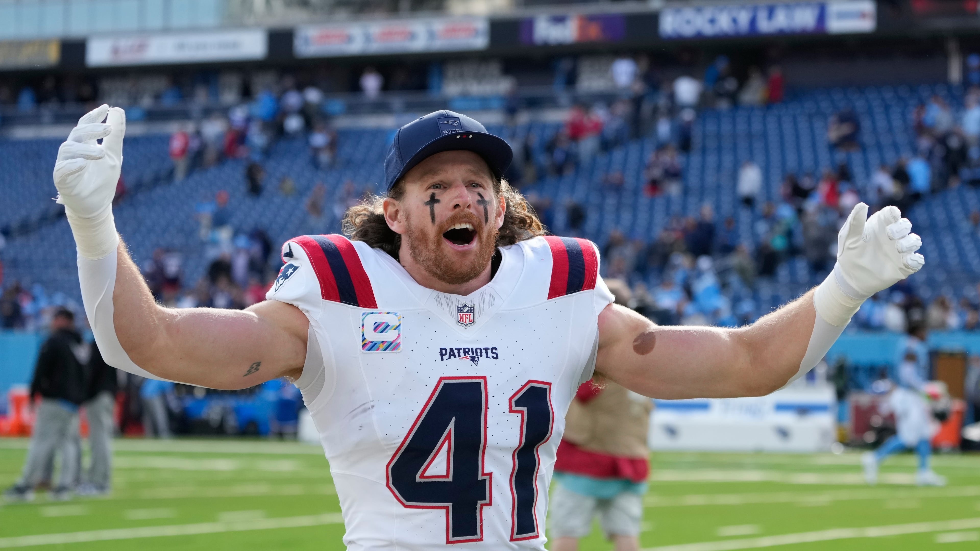 New England Patriots safety Brenden Schooler (41) celebrates following an NFL football game against the Tennessee Titans, Sunday, Oct. 19, 2025, in Nashville, Tenn. (AP Photo/George Walker IV)
