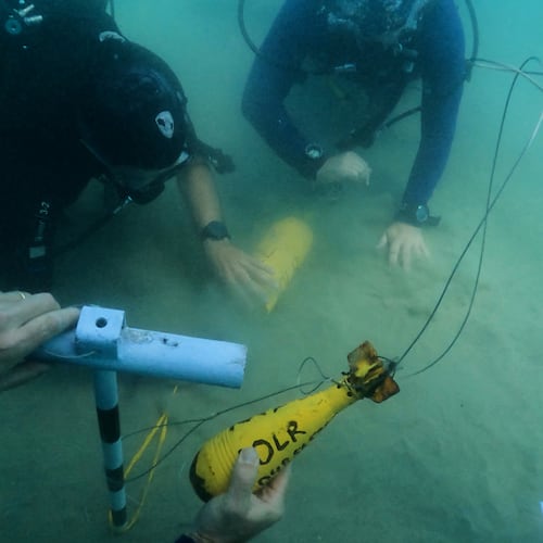 Divers place mock munitions on the floor of the Mediterranean Sea off the coast of Rishon LeZion, Israel, Sunday, June 21, 2026. (AP Photo/Sam Mednick)
