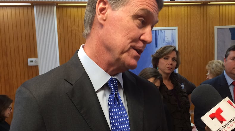 U.S. Senate candidate David Perdue answers questions about his business record at a campaign stop in Buckhead Monday. CHRIS JOYNER / CJOYNER@AJC.COM