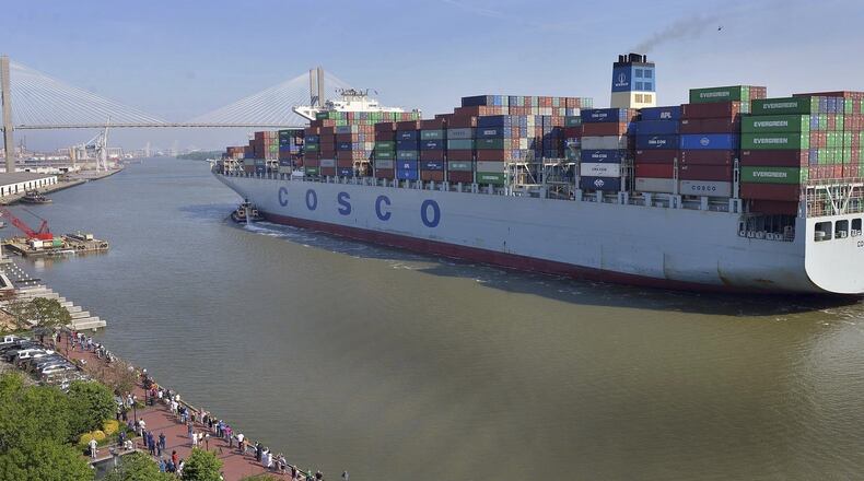 A crowd of well-wishers along River Street welcome the container ship COSCO Development, Thursday morning, May 11, 2017, in Savannah, Ga, as the vessel sails up the Savannah River to the Port of Savannah. The ship is the largest vessel ever to call on the U.S. East Coast. (Steve Bisson/Savannah Morning News via AP)