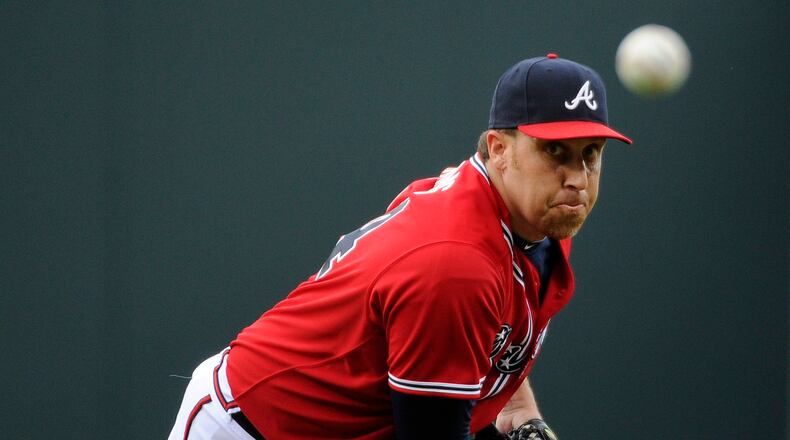 Atlanta Braves starting pitcher Aaron Harang delivers to the Los Angeles Angels during the first inning of a baseball game on Friday, June 13, 2014, in Atlanta. (AP Photo/David Tulis)