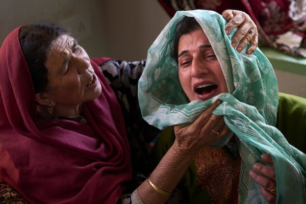 Relatives of Ahsan Ul Haq Shiekh, a militant who officials say is involved in the deadly attack on tourists in Pahalgam, wail after after Indian forces blew up the family home at Murran village in Pulwama, south of Srinagar, Indian controlled Kashmir, Saturday, April 26, 2025. (AP Photo/Dar Yasin)