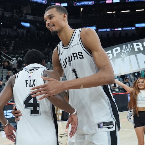 San Antonio Spurs forward/center Victor Wembanyama (1) greets guard De'aaron Fox (4) after Game 5 of a first-round NBA playoffs basketball series against the Portland Trail Blazers in San Antonio, Tuesday, April 28, 2026. (AP Photo/Eric Gay)